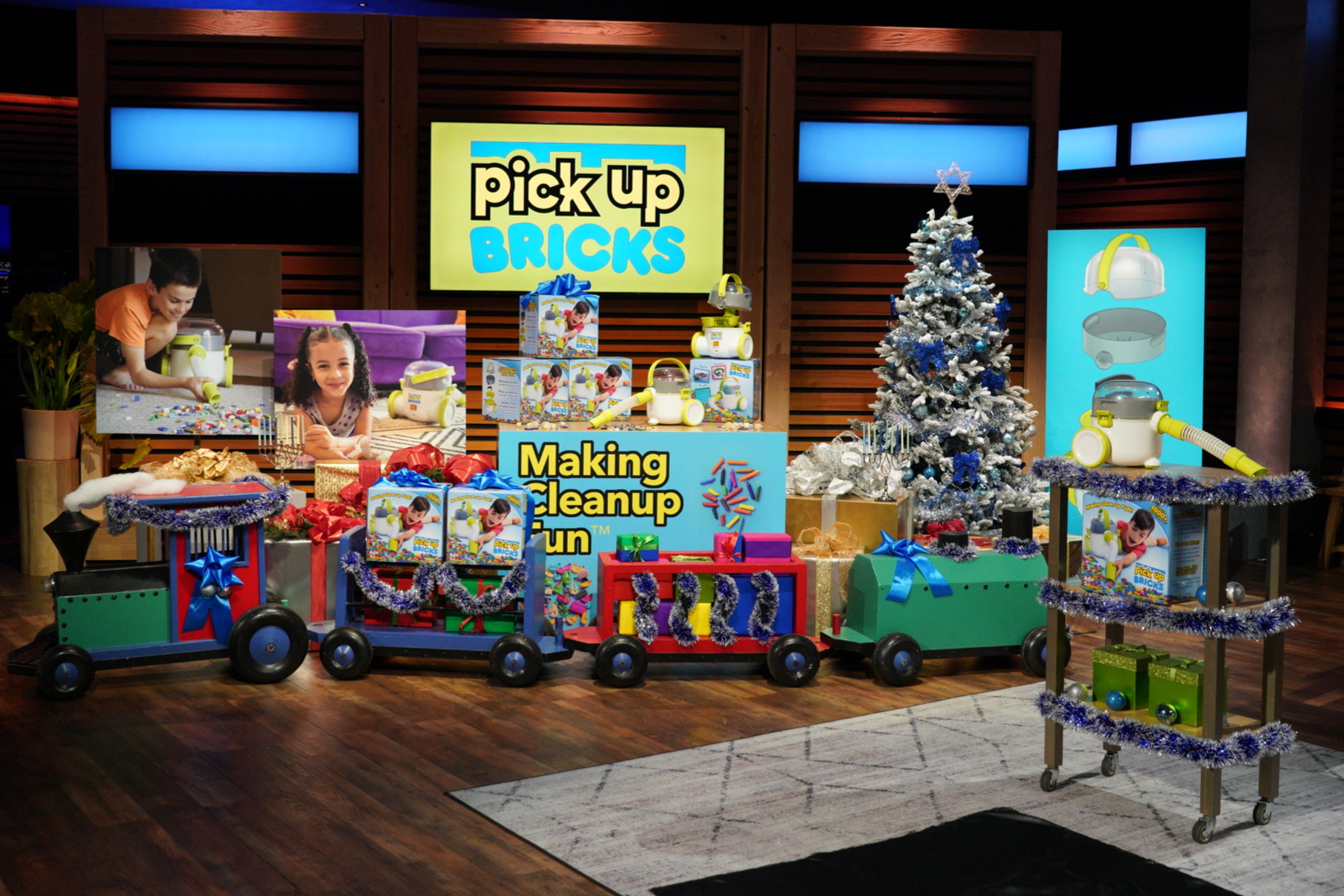 The Pick-Up Bricks display on the Shark Tank set with holiday flourishes